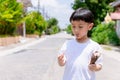 Child have enjoy for eating chocolate ice cream. Little boy eating an ice cream outdoors