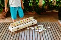 Child having fun with an educational wooden game at school, to make pairs, useful to improve the memory and dexterity of their