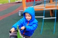 Child having fun at playground riding on the spring horse Royalty Free Stock Photo