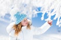 Child having fun in snowy winter park