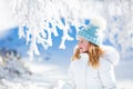 Child having fun in snowy winter park