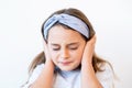 child headache stress anxiety girl clutching head