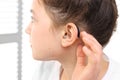 A child with a hearing aid