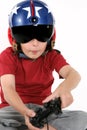 Child in helmet playing a flight simulator