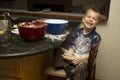 Child helping to bake Royalty Free Stock Photo