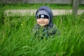 Child hiding in the grass Royalty Free Stock Photo