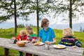 Child hiking in mountains. Picnic for kids.