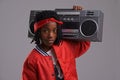 Child, hip hop and portrait with radio for cool music and dance in a studio with urban clothing. Fashion, African kid Royalty Free Stock Photo