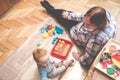 Child with his grandmother playing indoors Royalty Free Stock Photo