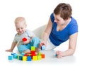 Child and his mom play with building blocks Royalty Free Stock Photo