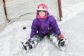 Child on the hockey ice with a puck