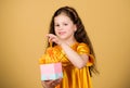 Child hold gift box. Favorite kids brand. Girl shopping gift store. Save money. Happy childhood. Pleasant surprise Royalty Free Stock Photo