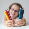 Child holding crayons