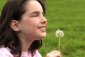 Child Holding Dandilion Looking Up Royalty Free Stock Photo