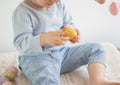 Child holding a decorative easter egg