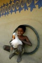 Child holding a duck