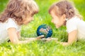 Child holding Earth planet in hands