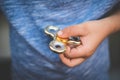 Child holding fidget, finger spinner