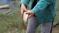 Child Holding A Fish With Both Hands Royalty Free Stock Photo