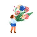 Child holding flower bouquet in hands. Cute tiny girl kid carrying huge floral bunch. Walking with spring blossomed