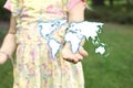 Child holding with hand earth map drawing. Global international concept