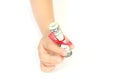 Child holding in a hand gift of money american hundred dollar bills with red ribbon on white background