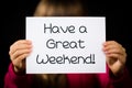 Child holding Have a Great Weekend sign Royalty Free Stock Photo