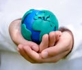 Child holding model of Earth Royalty Free Stock Photo