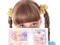 Child holding passport.