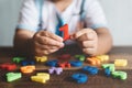 Child holding plastic toy number one, she is learning to count Royalty Free Stock Photo