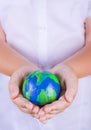 Child holding plasticine globe in hands Royalty Free Stock Photo