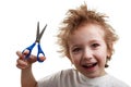 Child holding scissors