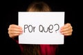 Child holding sign with Portuguese word Por Que - Why Royalty Free Stock Photo