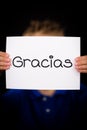 Child holding sign with Spanish word Gracias - Thank You Royalty Free Stock Photo