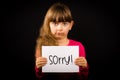 Child holding Sorry sign Royalty Free Stock Photo