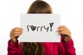 Child holding Sorry sign Royalty Free Stock Photo