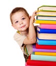 Child holding stack of books.