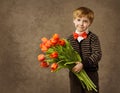 Child holding tulips flowers bouquet Royalty Free Stock Photo