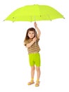 Child holds big green umbrella