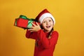 The child holds a box with a gift. Happy little girl with christmas present Royalty Free Stock Photo