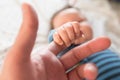 Child holds finger Mother holds the hand of her child. Mothers Day. father`s day Royalty Free Stock Photo