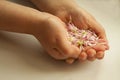 Child holds flower's petals