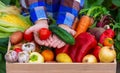 A child holds freshly picked vegetables in his hands. Vegetables in a box Royalty Free Stock Photo