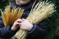 The child holds in the hands pasta Royalty Free Stock Photo