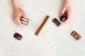 Child holds in one hand a package of pills and chocolate candy in the second hand Royalty Free Stock Photo