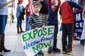 A Child Holds a Sign Reading `Expose Election Fraud Now` at a Stop the Steal Rally