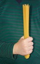 A child holds spaghetti in his hand Royalty Free Stock Photo