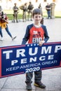 A Child Holds a Trump Pence Sign at a Stop the Steal Rally