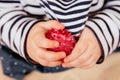 The child holds a virus crown in his hands. Conceptual photography