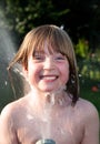 Child hosepipe water summer garden splash Royalty Free Stock Photo